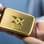 -up of a hand holding a gold bar with the XRP logo stamped on it, reflecting light off its smooth surface