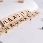 health insurance scrabble tiles on planner