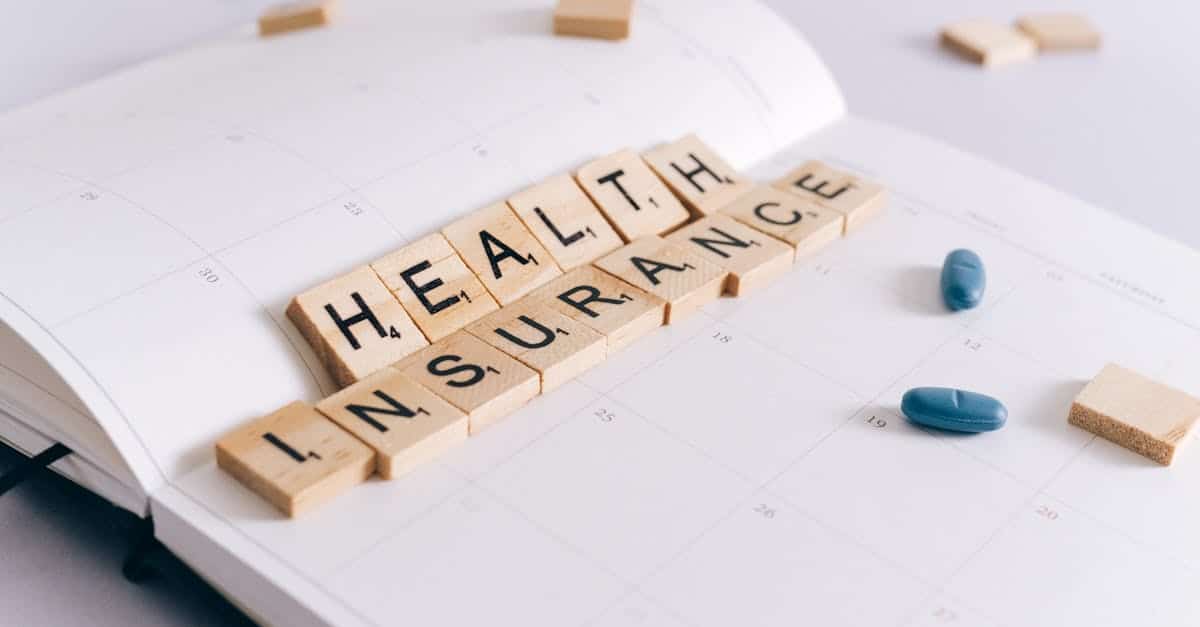 health insurance scrabble tiles on planner