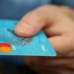 person holding debit card 1