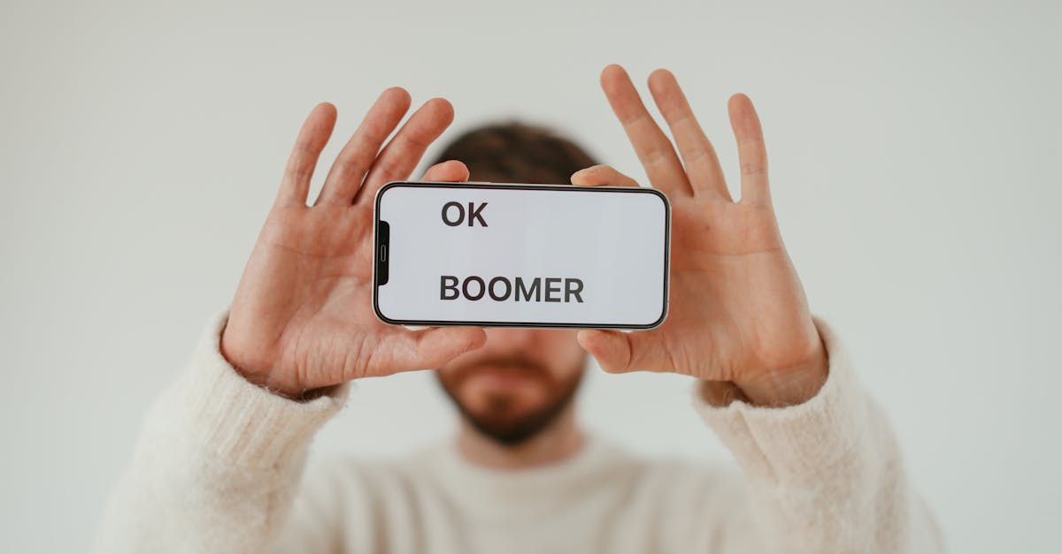 man holding smartphone with phrase on screen